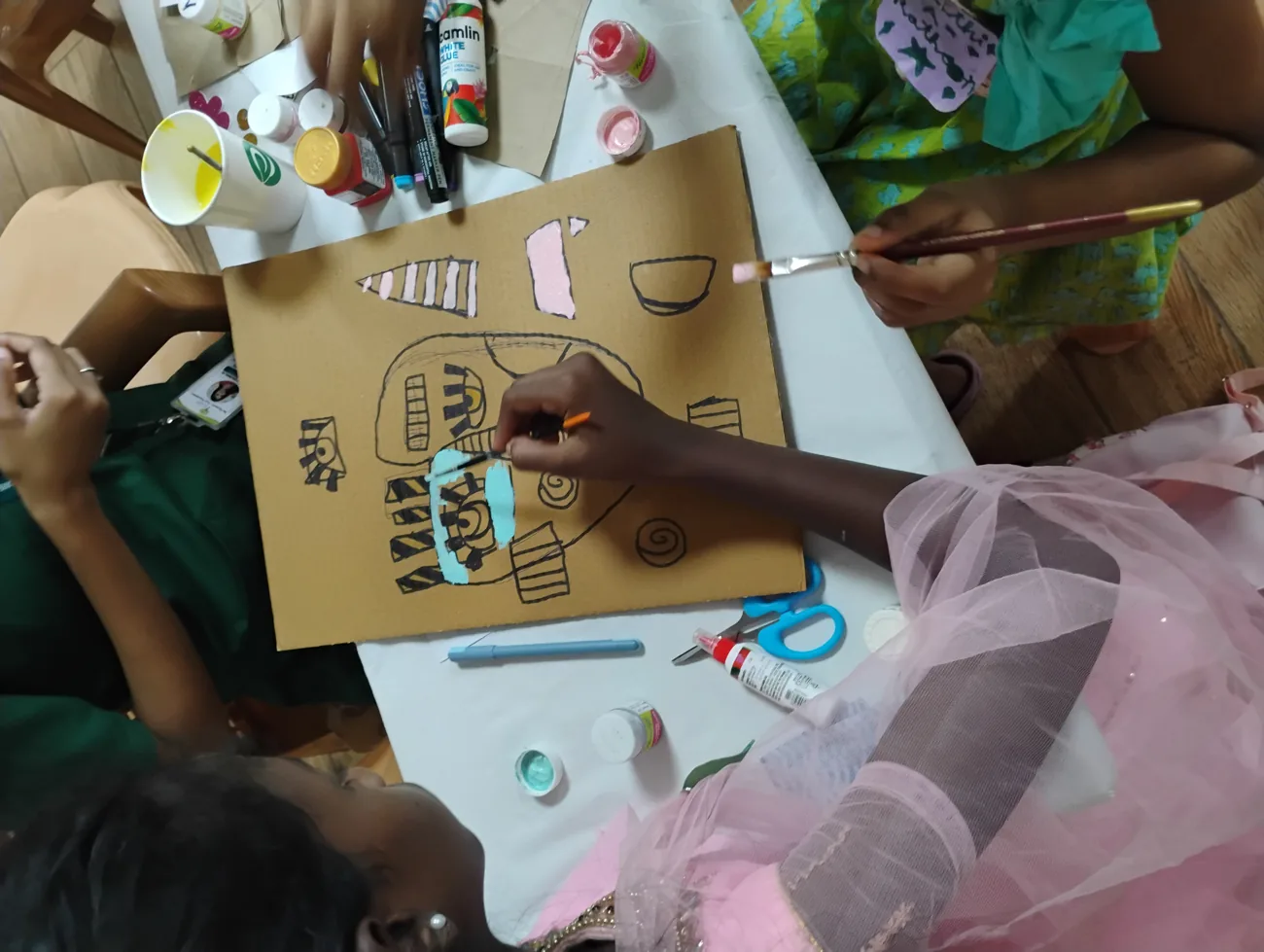 A child painting during a Brushstrokes of Emotion session in India